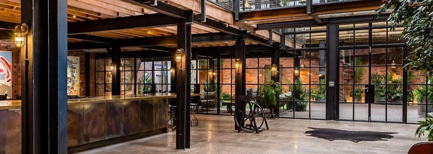 Inside a brown structured building with plants